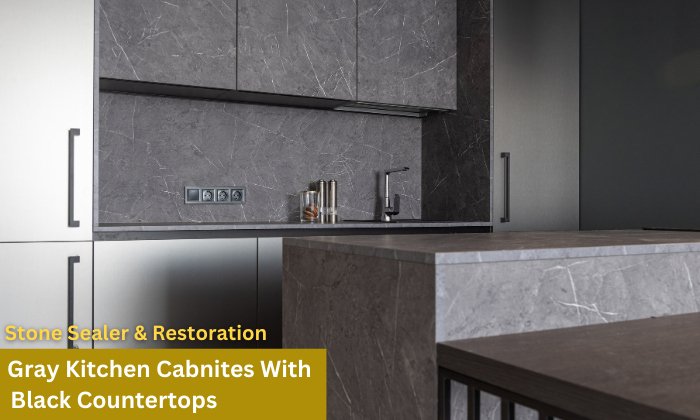 Grey kitchen cabinets with black countertops